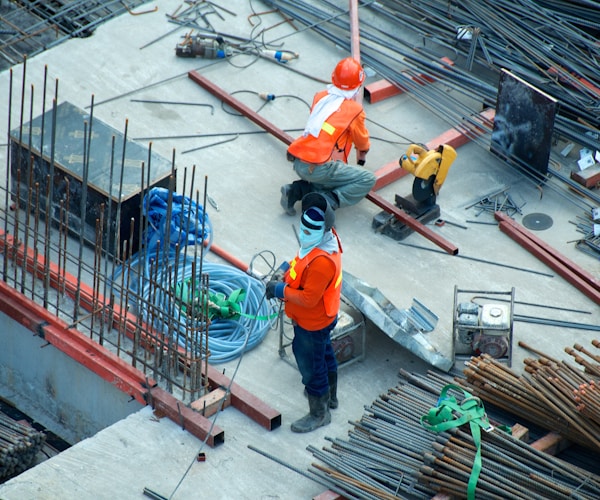 Construction worker reviewing blueprints